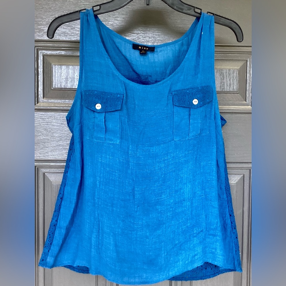 Beautiful Blue Sleeveless Blouse. Two Button Pockets Front and Full Lace Back.